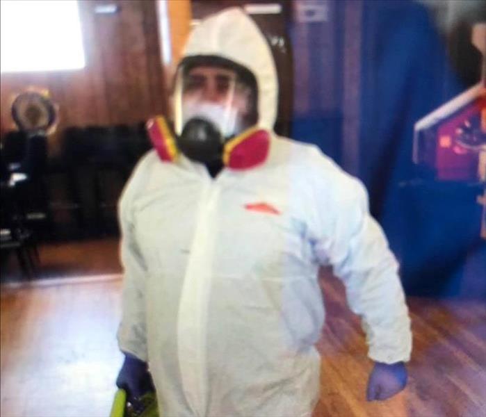 Team member in personal protective equipment during a mold remediation job.